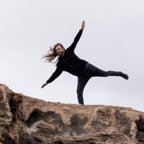 Man balancing on a cliff