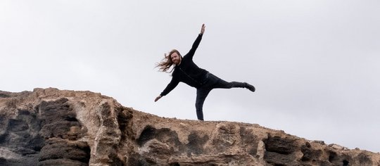 Man balancing on a cliff