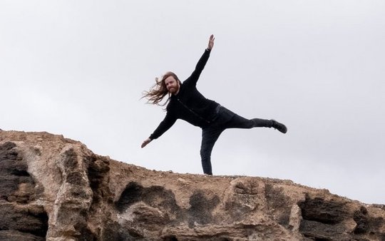 Man balancing on a cliff