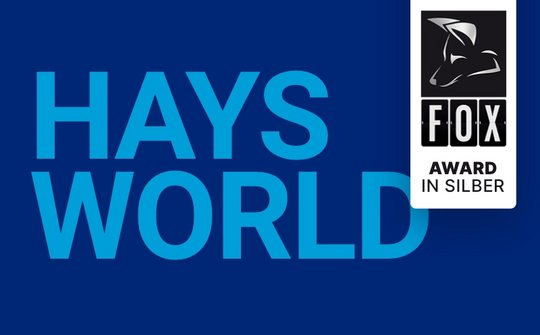HaysWorld Logo auf blauem Hintergrund mit FOX Award Gewinner Teaser 